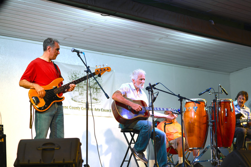 Bob Tellefsen performing in Honesdale with Chip Forelli on bass, Kenny Christianson on conga and Tony Maddi on electric guitar