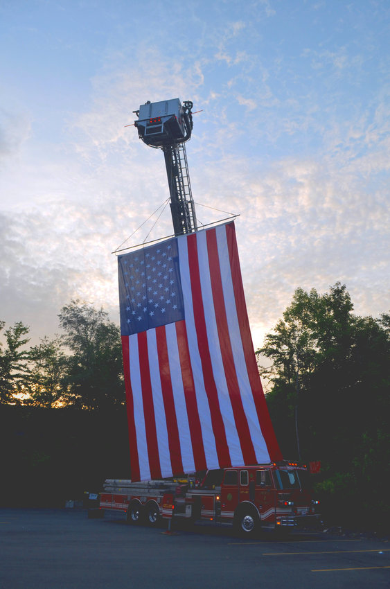 An American flag flies from a Liberty Fire Department truck, waving over the International Overdose Awareness Day vigil.