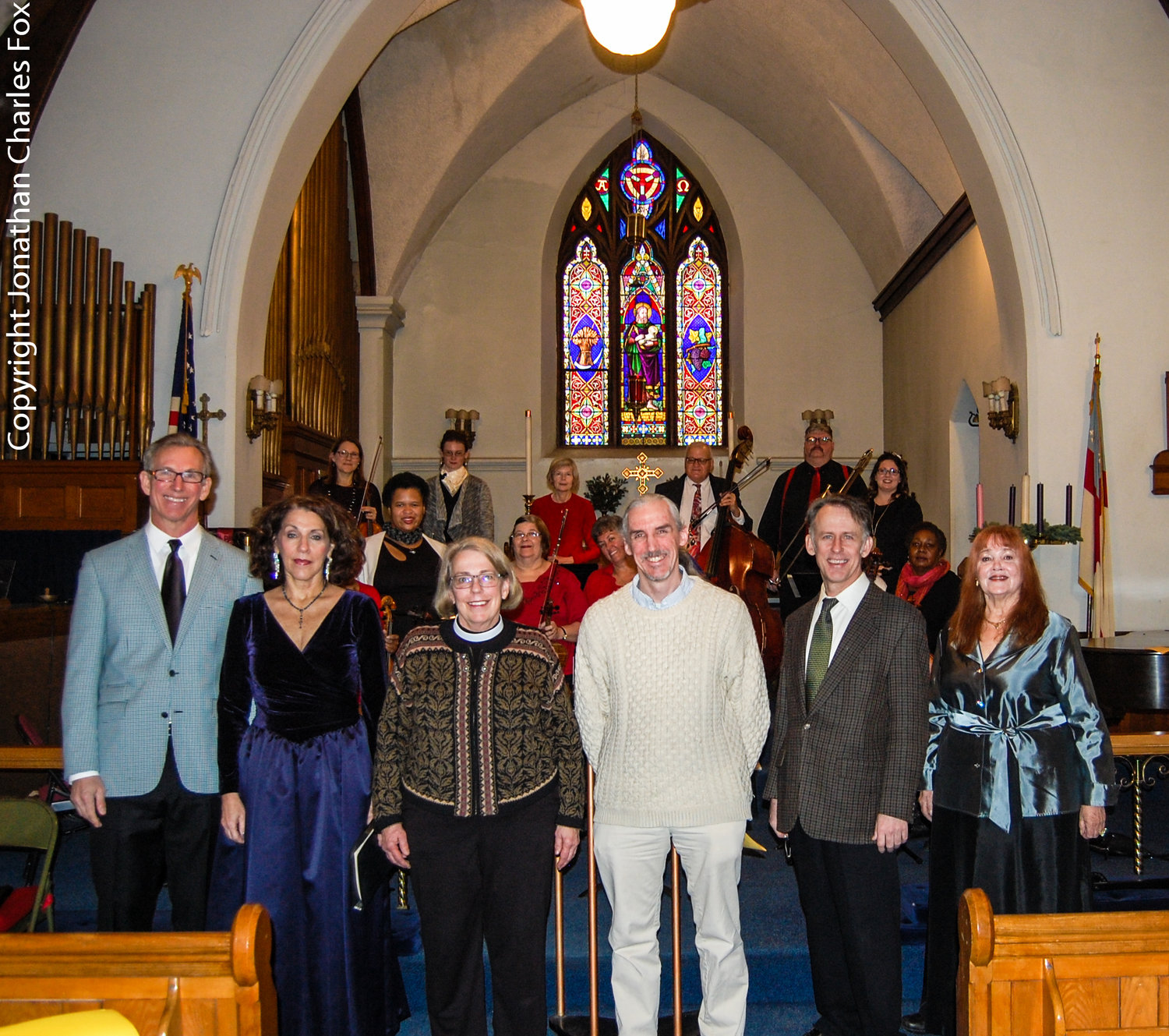St. John’s Rev. Diana S. Scheide with WJFF’s Dan Rigney, center, are seen here flanked by soloists John Weidemann, Janice Meyerson, left, and Kevin Hanek and Kathy Geary, right, with the musicians who accompanied the Handel’s “Messiah” sing-along behind them.