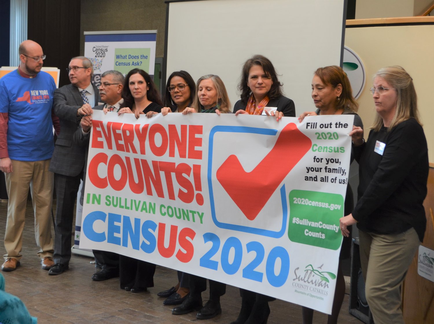 Pictured posing with a new banner related to the census are Dan Hust, Sullivan County communications director, left; Robert Dufour, superintendent of BOCES; Dawn Ciorciari, general manager Bold Gold Media NY; Saraid Gonzalez, Sullivan 180; Sandi Rowland, Sullivan 180; Freda Eisenberg, Sullivan planning commissioner; Mary Berk, U.S. Census; and Mary Paige Lang-Clouse, Ethelbert B. Crawford Library Director.