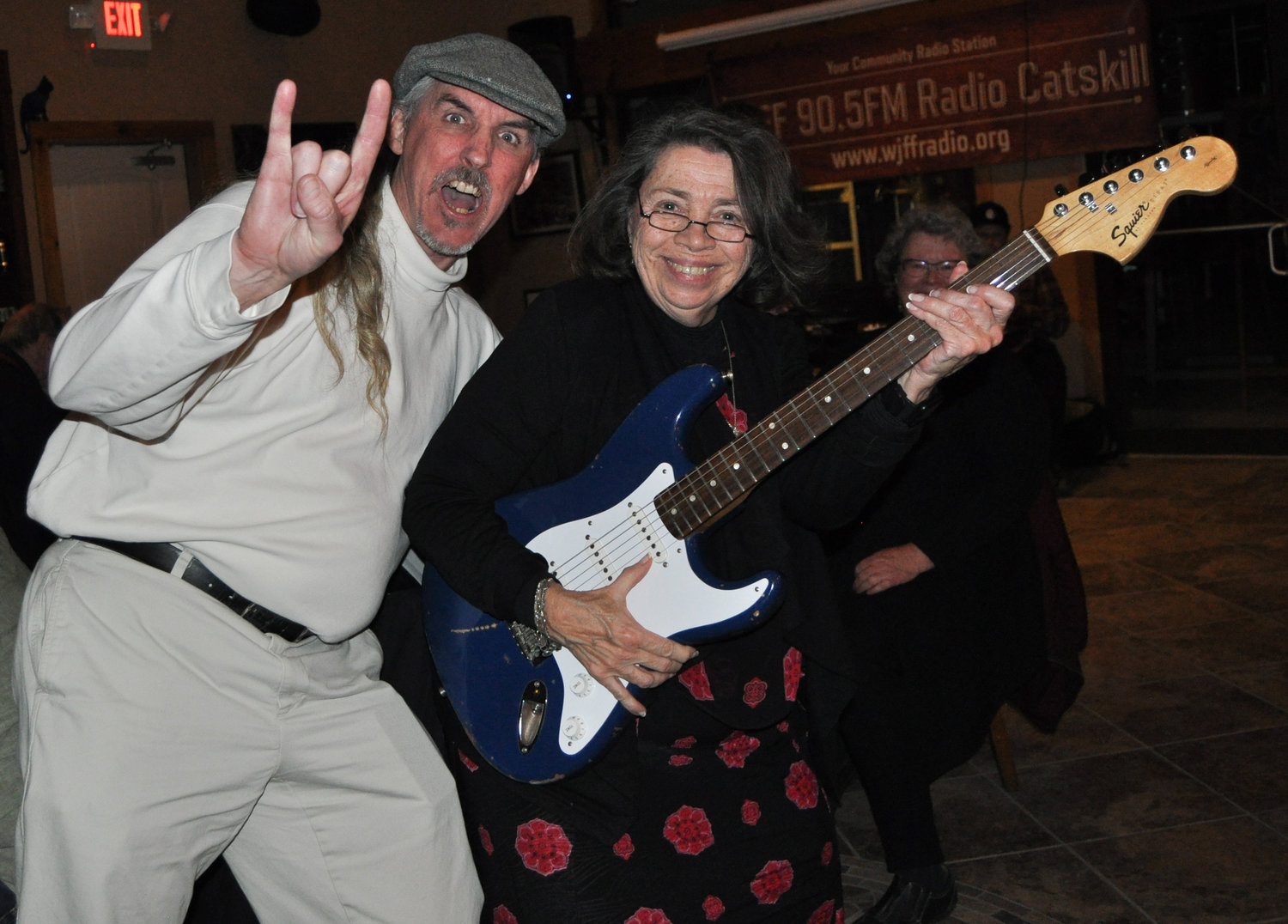 WJFF Radio General Manager Dan Rigney presented door prize winner Theresa Maelia with a restored Fender Squire contributed by Glenn Lazarro’s Guitars4Good, which repairs and donates the instruments to disadvantaged adults, kids and charitable organizations.