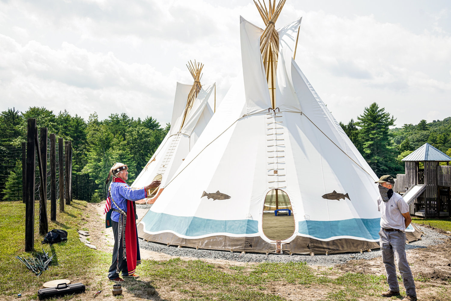 Navajo elder Jake Singer, left, and Peter Comstock, Head of the Homestead School, in front of one of the tipis.