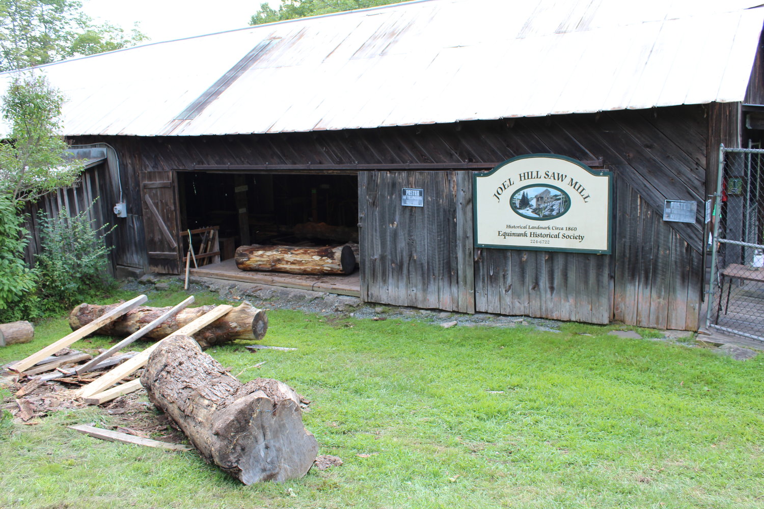 The Joel Hill Sawmill has stood since 1865. Here, logs await their turn in the mill.