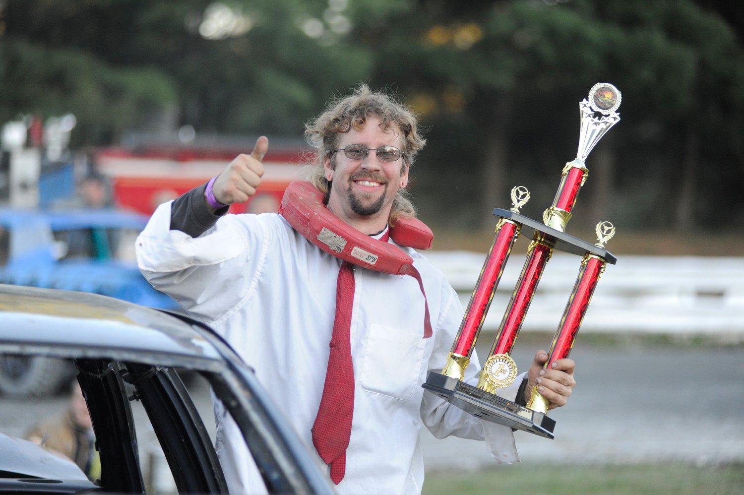 Dressed for success. The first-place trophy in the bone stock V8 class went to Jereme Spanburgh, of Scranton, PA, who engaged in an epic battle with the driver of demo car #17 that, along with his car, was a testament to the strength of American steel. Asked about his red tie, Spanburgh said he always tries to look his best at demolition derbies.
