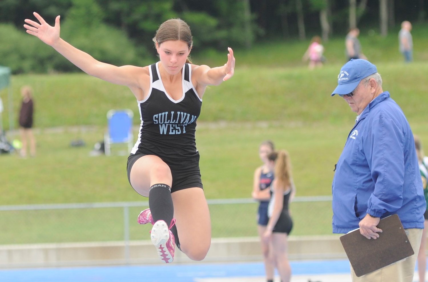 Abby Parucki was chosen as the Most Valuable Player in Girls Varsity Golf in 2021. She is pictured here competing in the long jump at a homestand track and field meet.