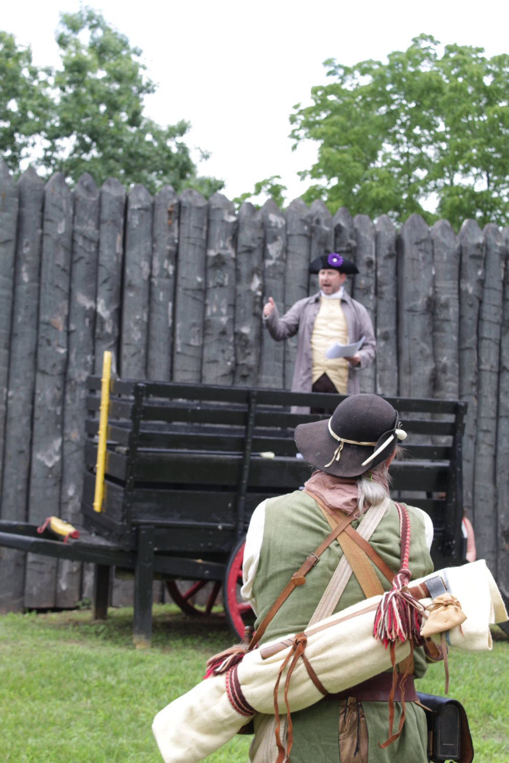 “You are long-winded. I have a long barrel.” Re-enactor and Patriot Charles Redner (back to camera) comments while Bill Chellis reads a Loyalist response.