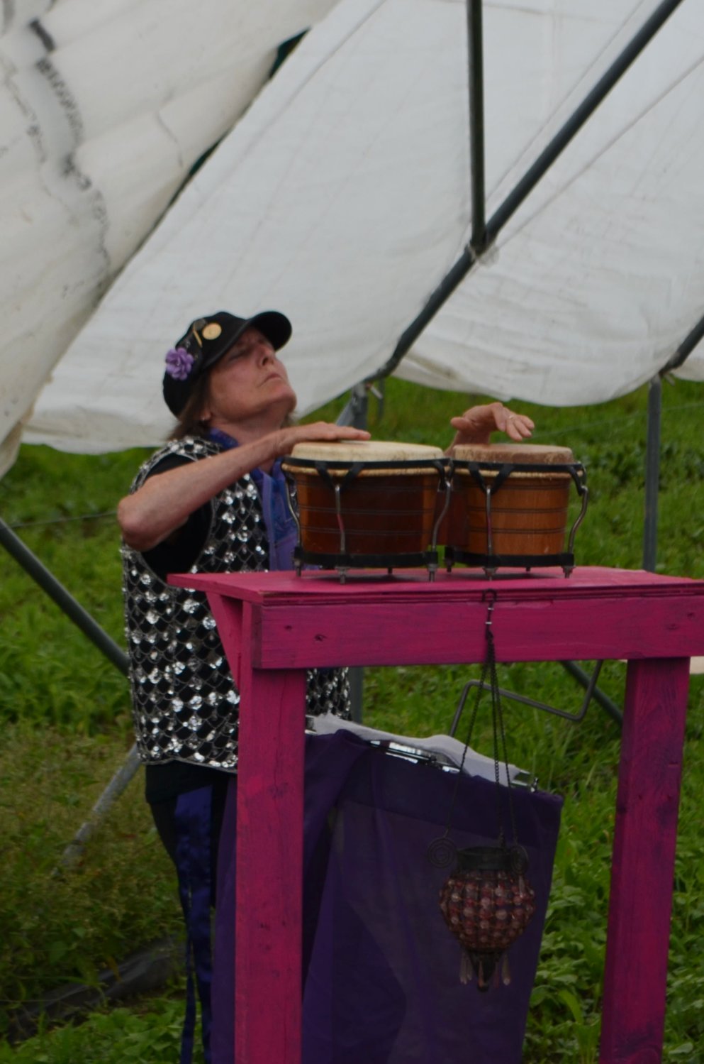 Pam Arnold providing accompaniment on the drums.