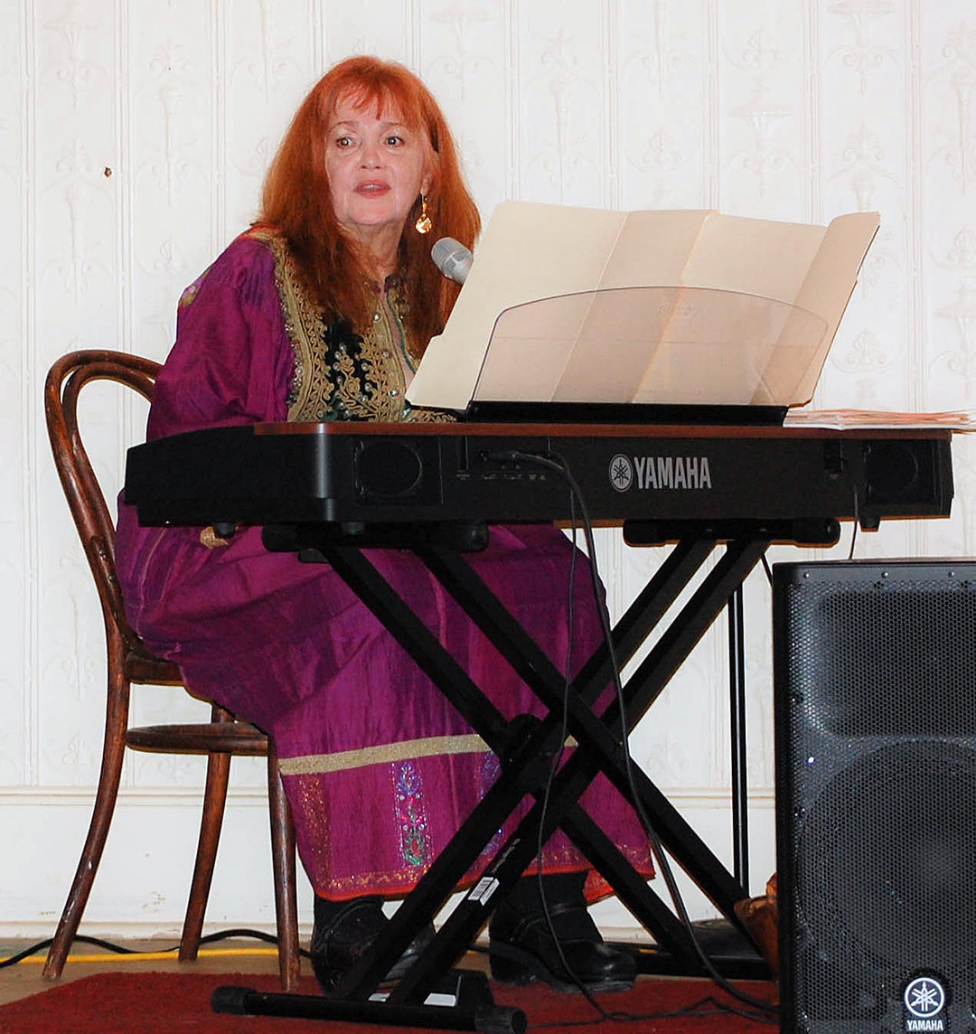Playing both guitar and keyboards, Kathy Geary entertained in the ballroom at the Western Hotel, sharing songs and stories covering Joni Mitchell's career.