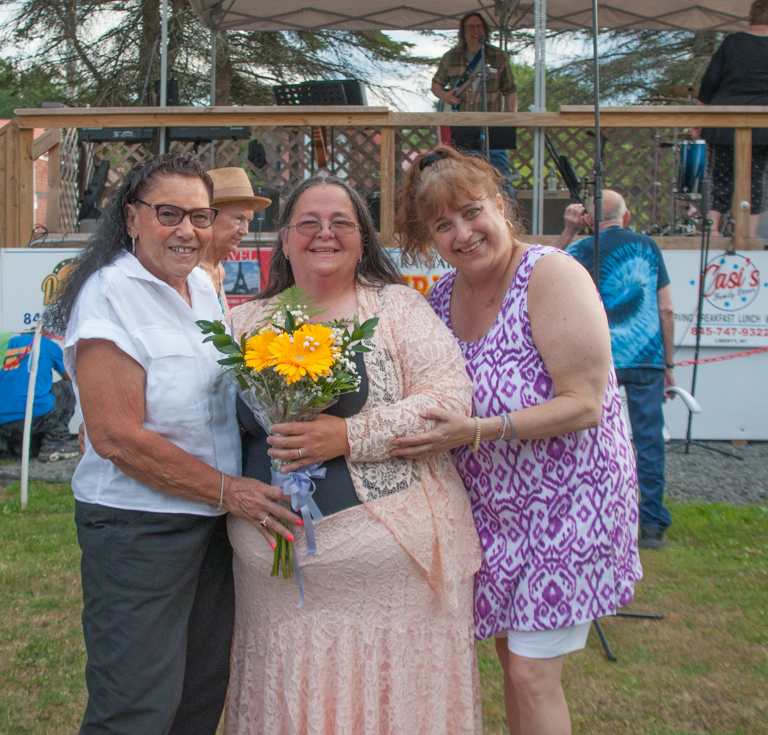 Newlywed Laura Garone, center, surprised family and friends during an outdoor concert by tying the knot with Gregory Scott Cherry. Only her bridesmaids, the groom and Dharma the Wonder Dog were in on the secret. Oh, right... I was there, too. Congratulations!
