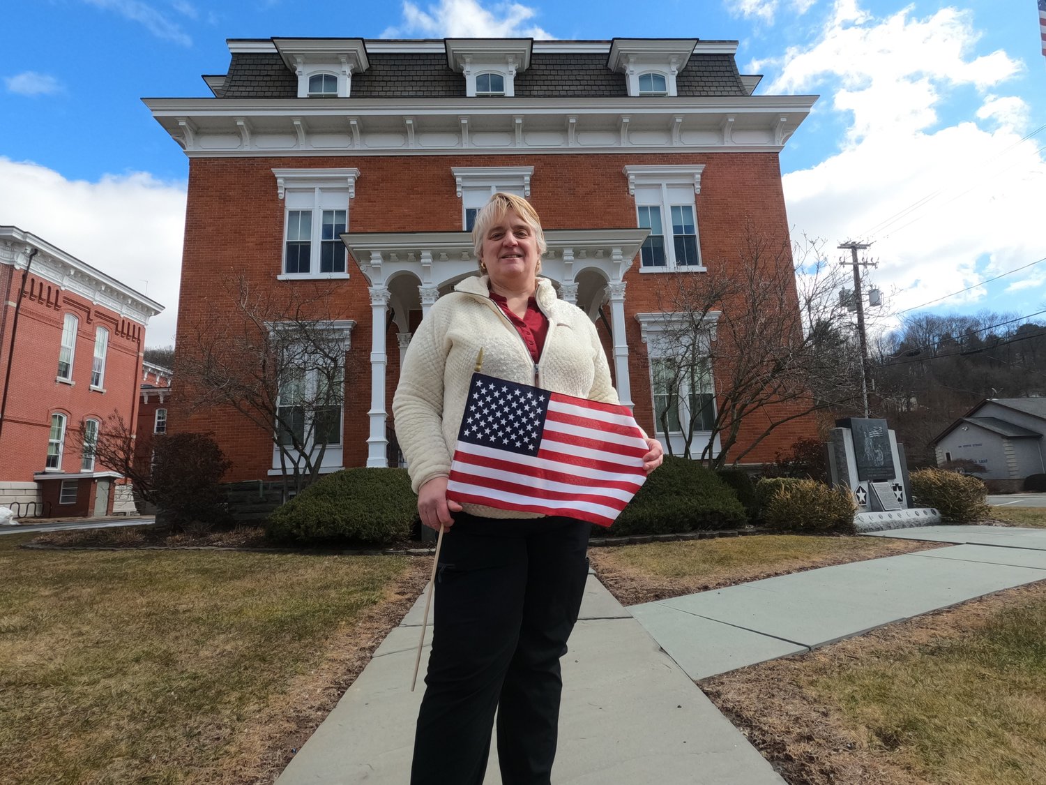 Kim Erickson stands in front of the Dimmick Building, a historic Honesdale building that once served as the county’s first hospital. She plans to place a monument to female veterans here.